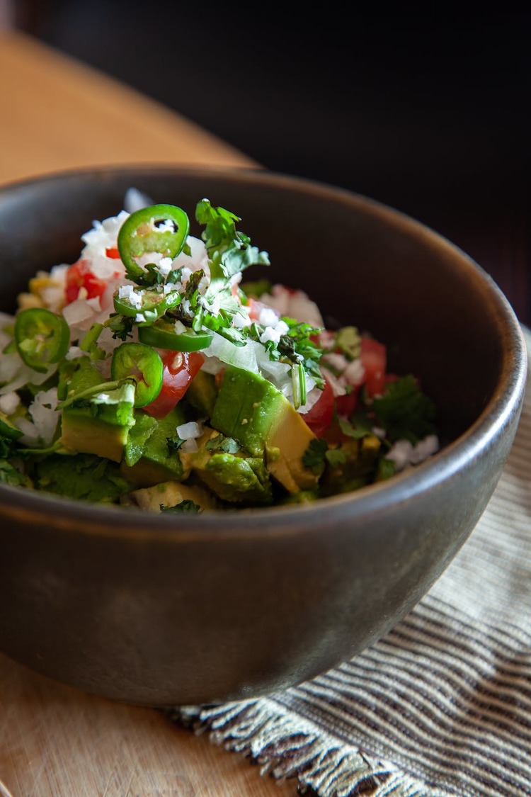 Guacamole Bowl with Rice, Corn, Cilantro and Jalapeno Peppers Recipe